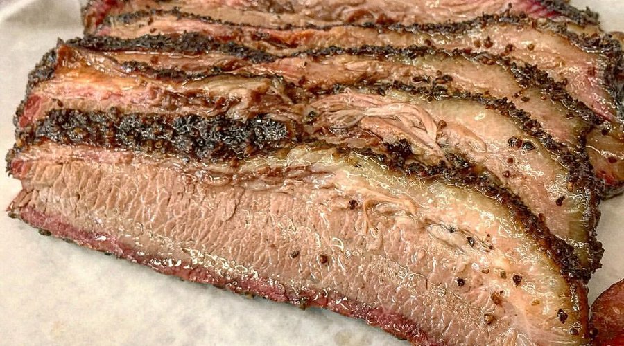 City Limits Barbeque signature dishes Prime Brisket, Pork Spare Ribs, Housemade Sausage, Mac and Cheese